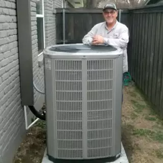 Michael just finishes making an HVAC repair.
